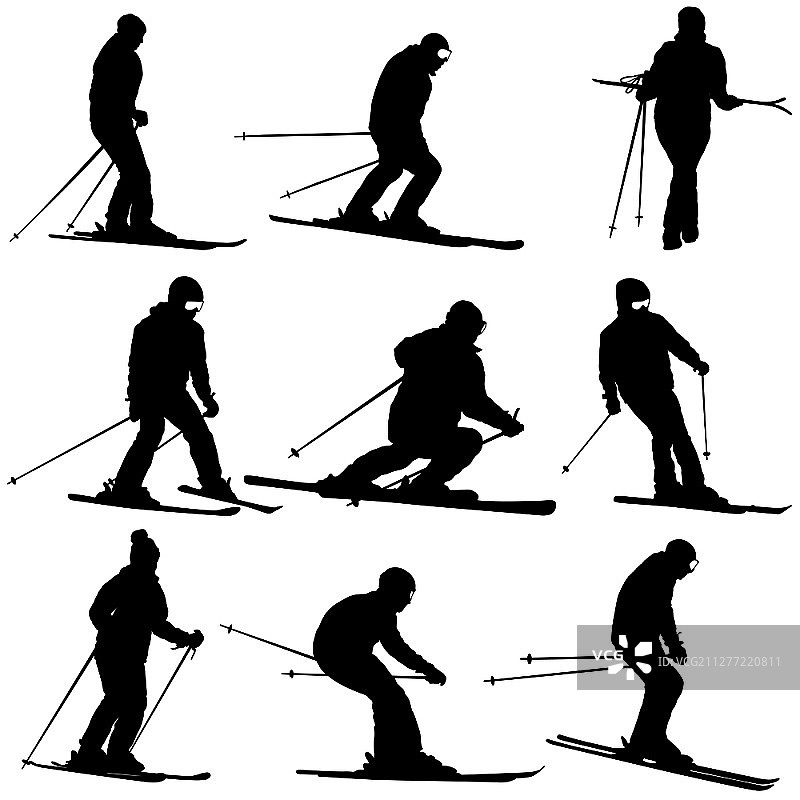 滑雪者从山坡上快速滑下运动剪影图片素材