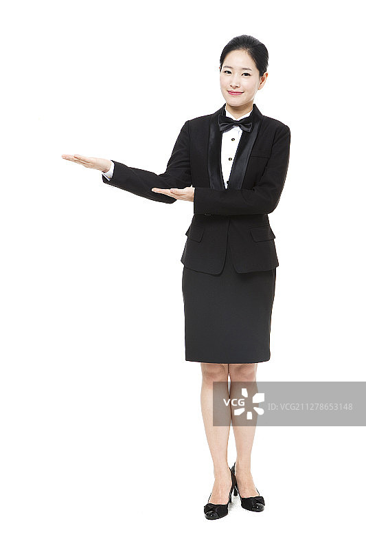 女子穿着制服做引导动作的摄影作品图片素材