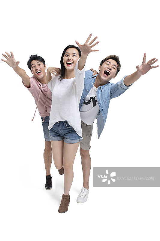 快乐的年轻朋友们伸手图片素材