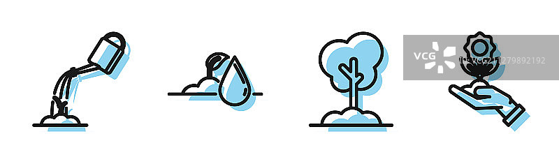 地上生长的树、喷壶图片素材