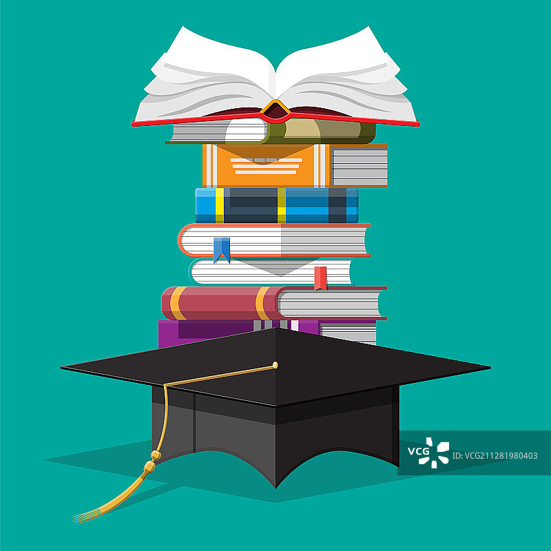 书堆上的毕业帽图片素材