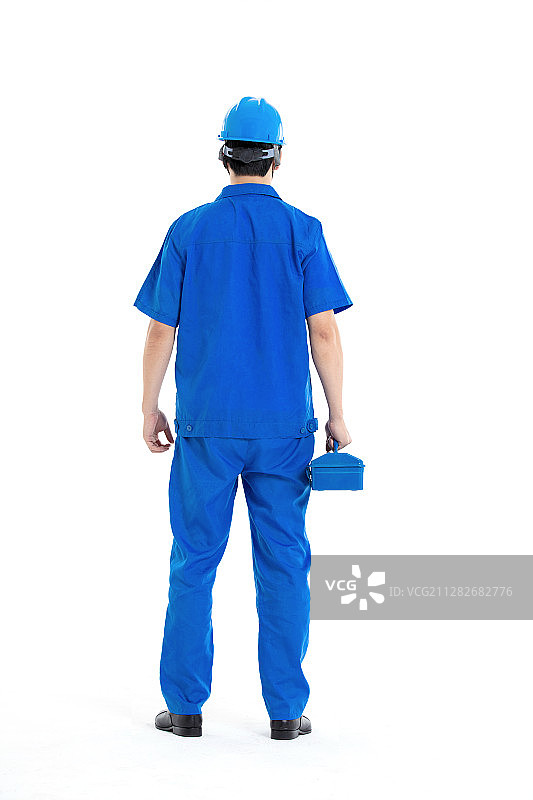 手拿工具箱的年轻男子图片素材