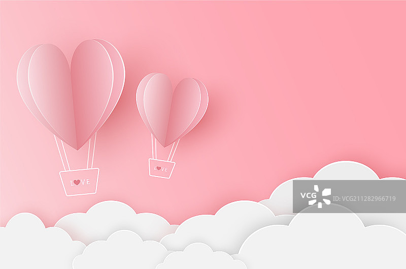 在粉色天空飞翔的纸质心形气球图片素材