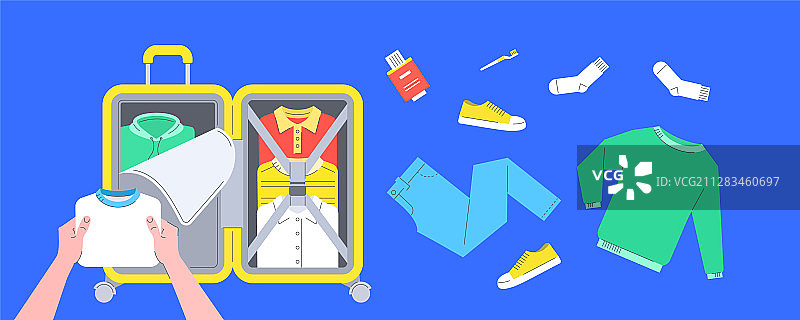 旅行时将衣服打包到手提箱里图片素材