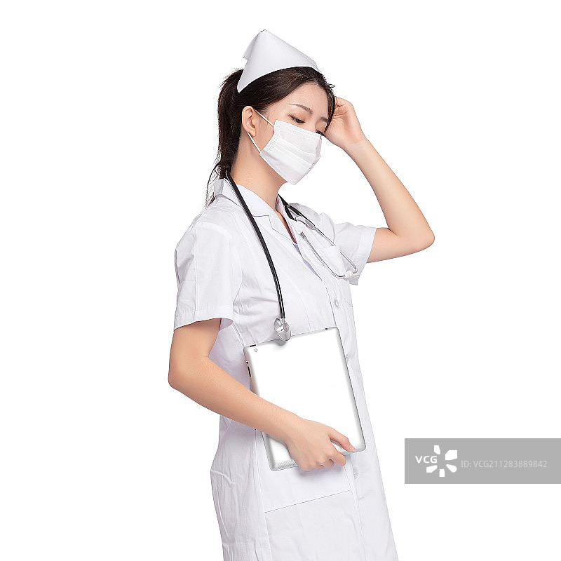 带着口罩拿着平板电脑的年轻女医师图片素材