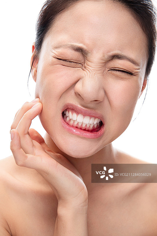 牙齿疼痛的青年女人图片素材