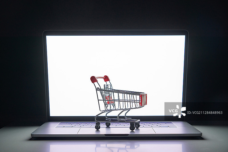 笔记本电脑和购物车图片素材
