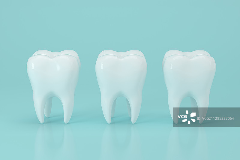 蓝色背景下三个牙齿模型 3D渲染图片素材