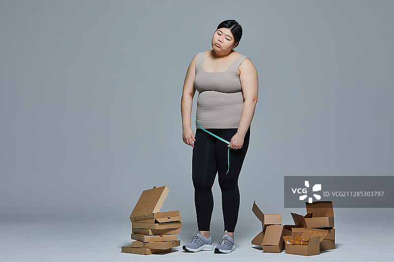 饮食、肥胖、腹部肥胖、腰围、压力、暴饮暴食、贪食症图片素材