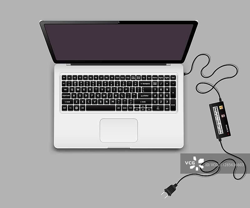 带未插电笔记本充电器的笔记本电脑图片素材