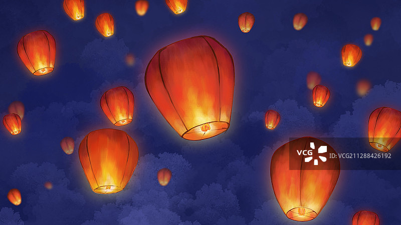 蓝色夜空下放飞多个许愿孔明灯图片素材