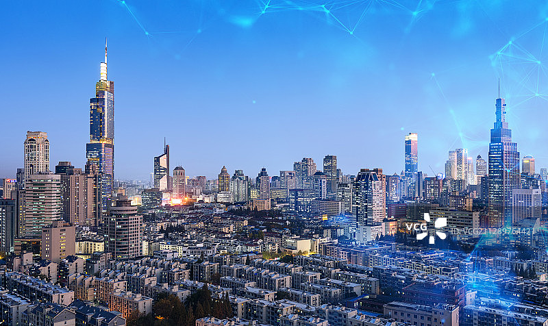 科技线条粒子合成的蓝调城市天际线图片素材