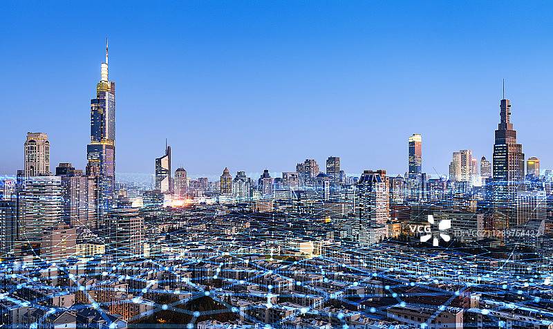 科技线条粒子合成的蓝调城市天际线图片素材