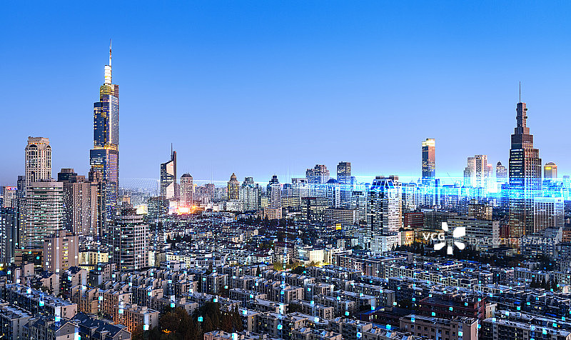 科技线条粒子合成的蓝调城市天际线图片素材