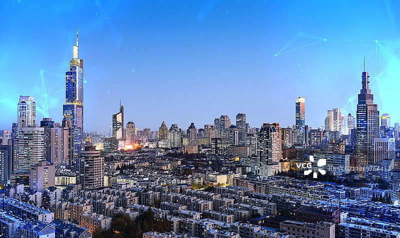 科技线条粒子合成的蓝调城市天际线图片素材