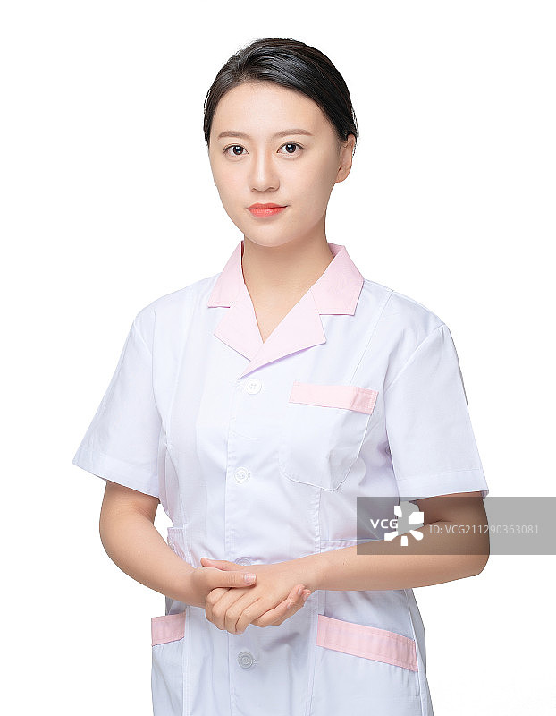 白色背景里，站立着的年轻女护士图片素材