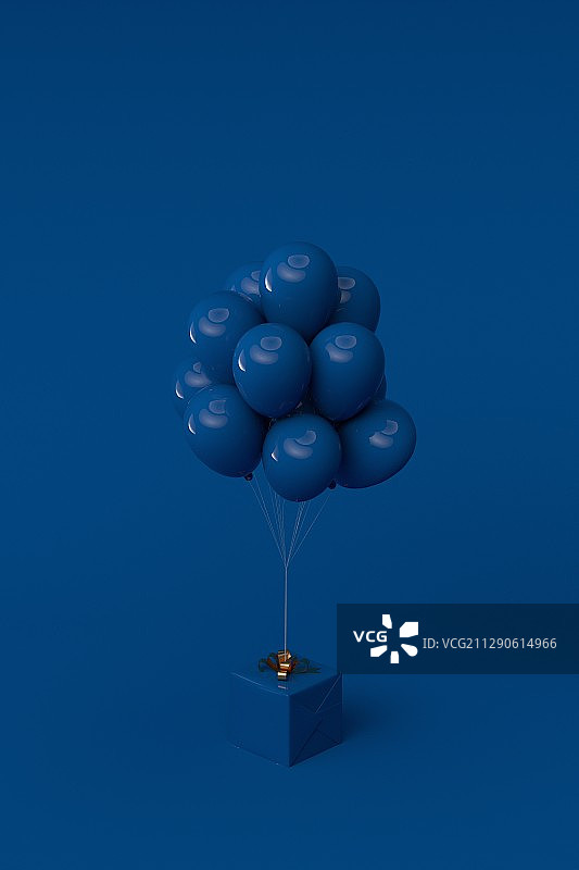 绑着气球的礼物盒在柔色背景上图片素材