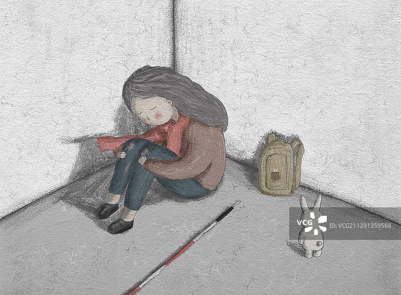 小女孩蜷缩在墙角哭泣图片素材