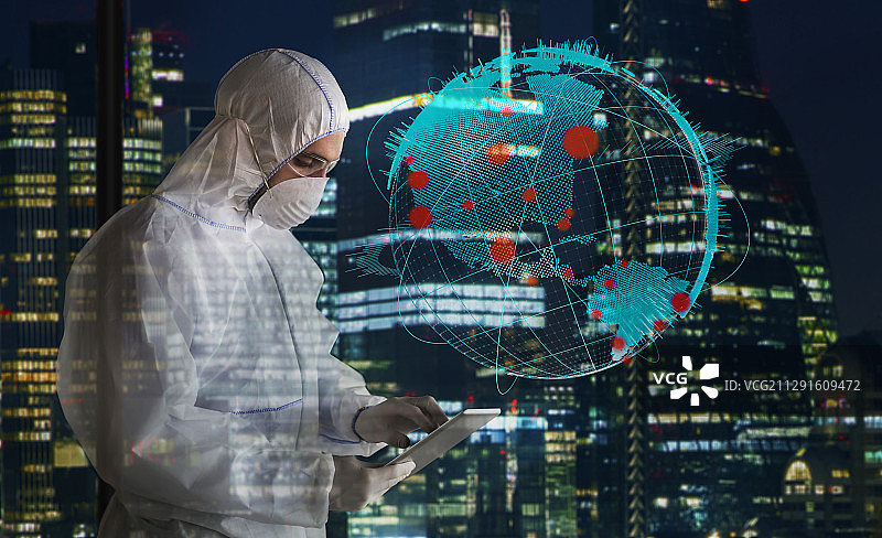 疫情期间身穿洁净服的科学家工作到深夜图片素材
