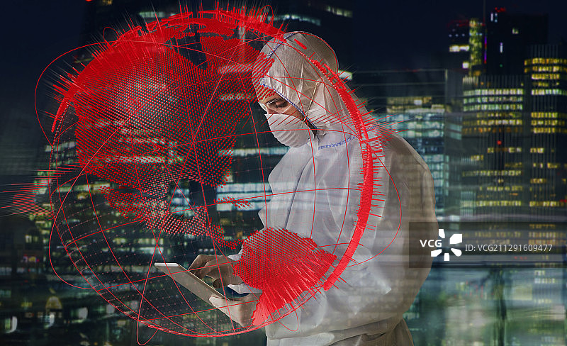 穿着洁净服的科学家在全球冠状病毒大流行中工作到深夜图片素材