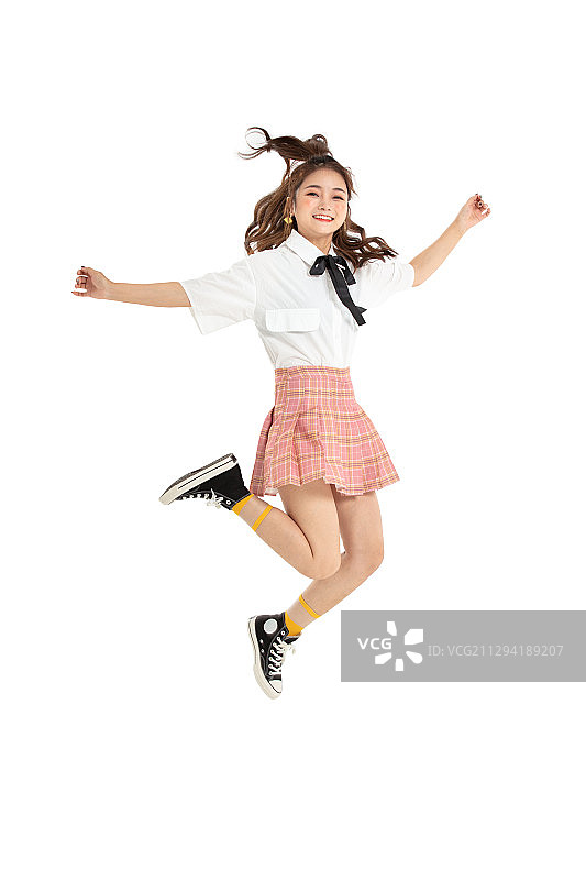 跳跃的年轻女学生图片素材