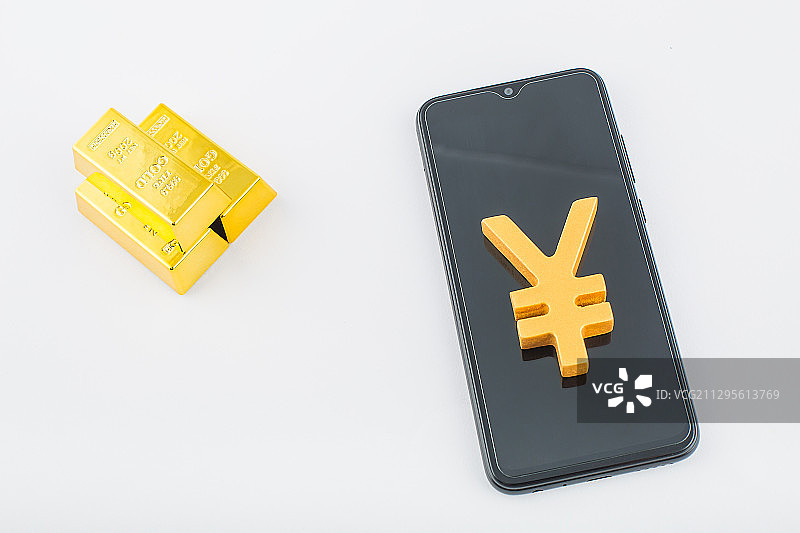 手机和金块，数字货币主题图片。图片素材