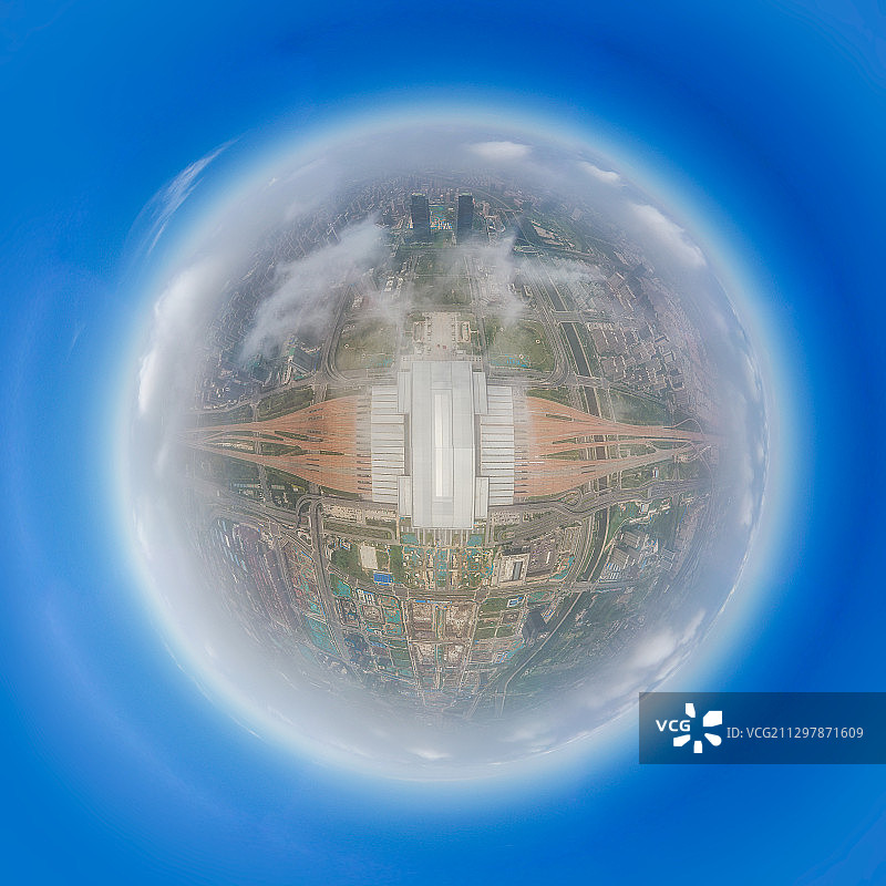 河南郑州郑东新区郑州东站高铁站星球小行星306度高空航拍图片素材