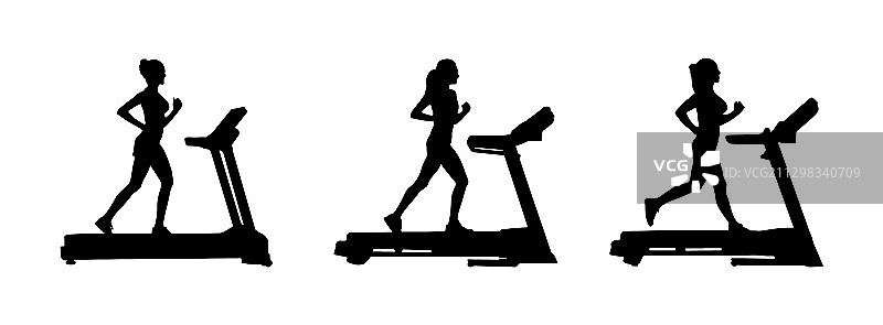 跑步机上的女性剪影图片素材