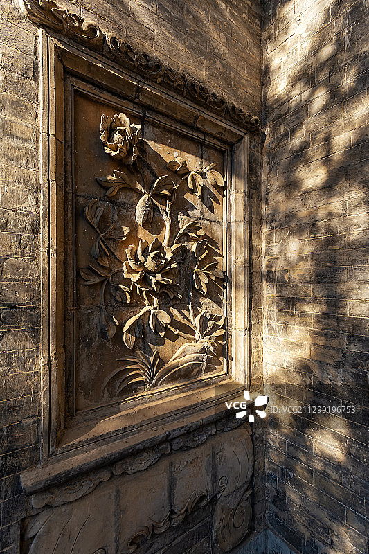 西安关中民俗艺术博物院墙上的石雕图片素材