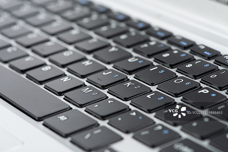笔记本键盘局部特写，办公背景图片素材