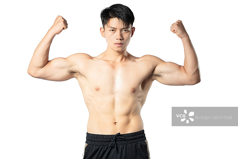 纯色背景里的健身肌肉男孩图片素材