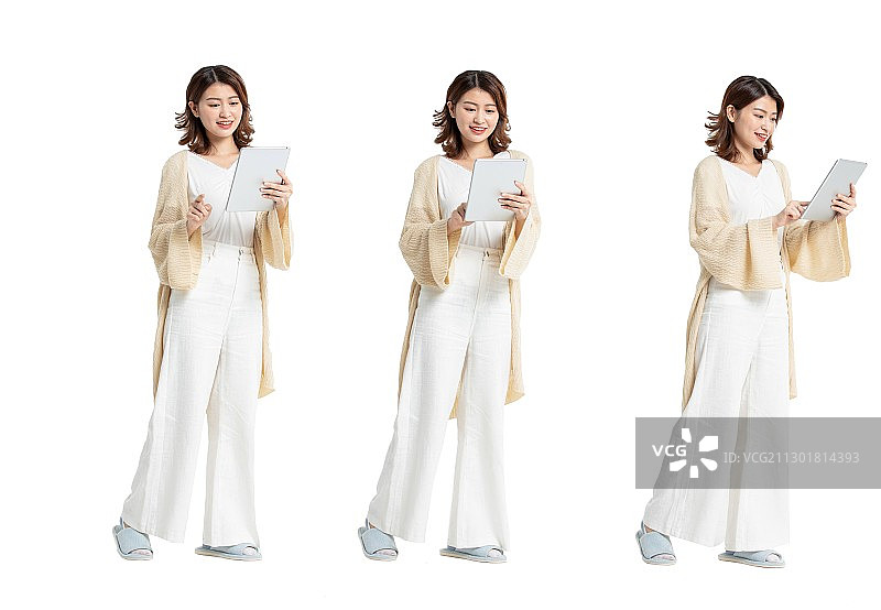 使用平板电脑的年轻女性图片素材