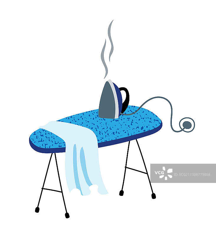 熨衣板上的平板熨斗图片素材