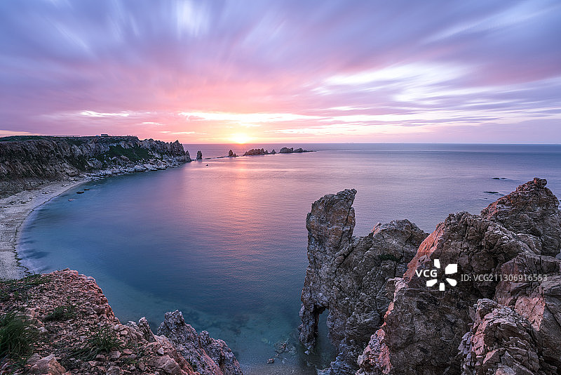 大连排石海上日落晚霞荧光海岸图片素材