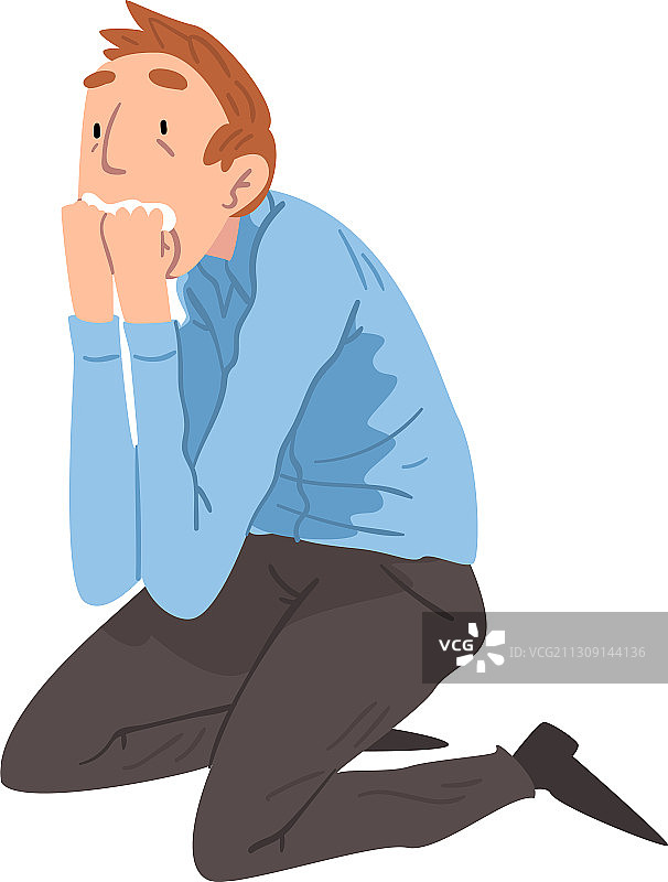 害怕的年轻男人跪坐在地上图片素材