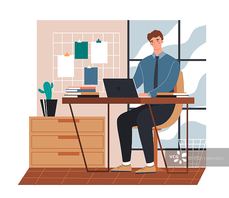 工作期间使用笔记本电脑的年轻男人图片素材