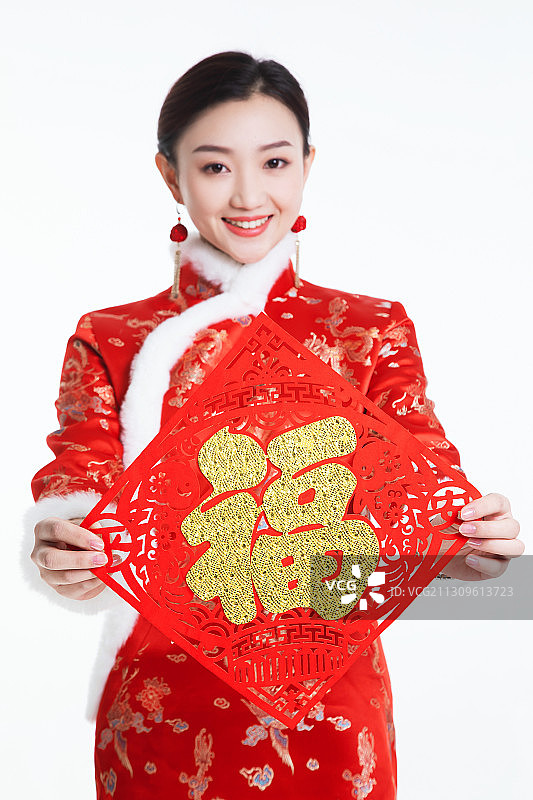穿唐装的年青女子手举福字图片素材