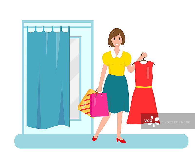 在试衣间旁拿着新裙子的微笑女人图片素材