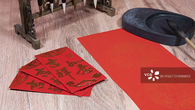 新春写对联红包过新年图片素材