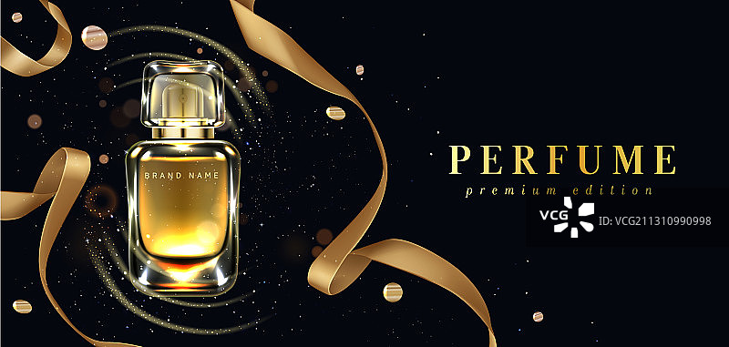 黑色背景上的香水瓶和金色丝带图片素材