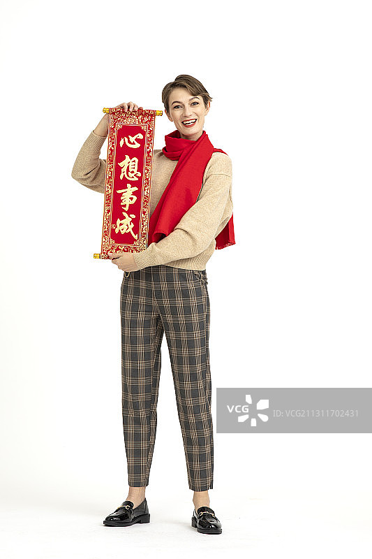 手拿春晖的年轻西方女性图片素材