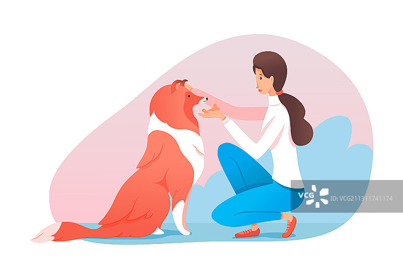 女训练员用甜饼干奖励狗图片素材