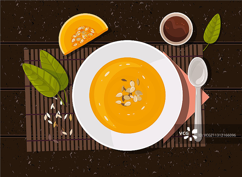 餐桌上的南瓜汤和勺子（俯视）图片素材