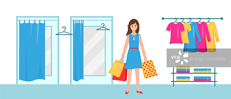 在购物中心携带购物袋的微笑的女士们图片素材