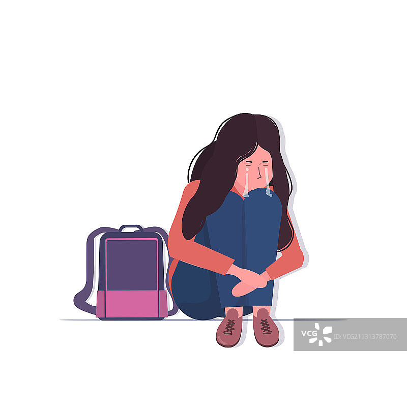 背着书包哭泣的沮丧女学生图片素材