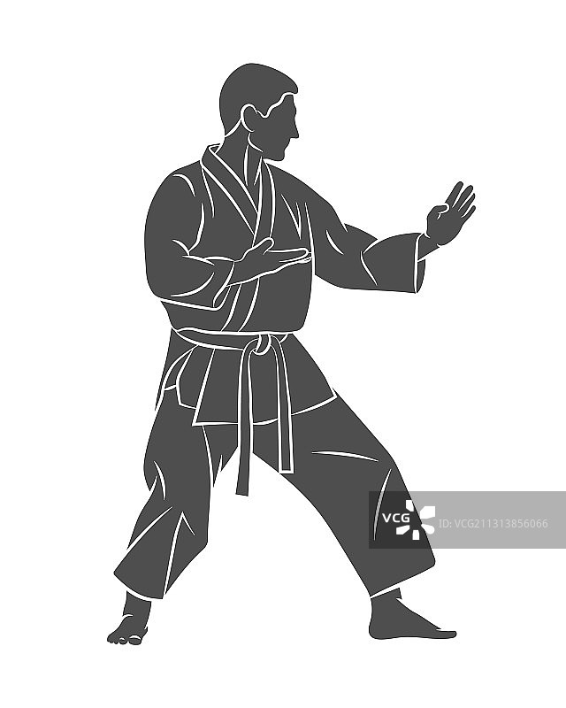 身穿和服的男人在白色背景上练习空手道图片素材