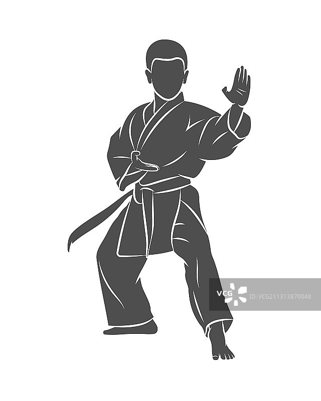 穿和服的男孩在白色背景上练习空手道图片素材