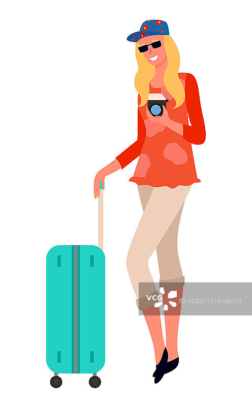 携带行李箱和相机的游客女人图片素材