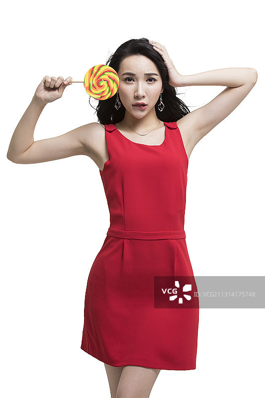 年轻时尚女性拿着棒棒糖图片素材