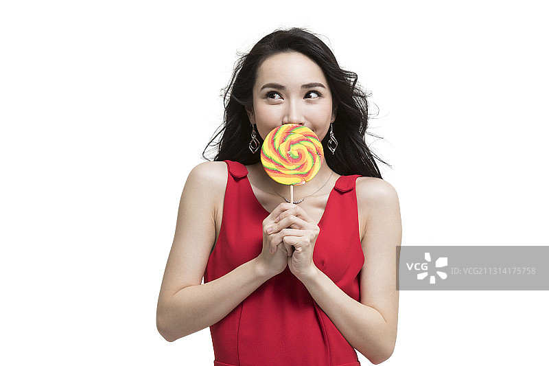 年轻时尚女性拿着棒棒糖图片素材